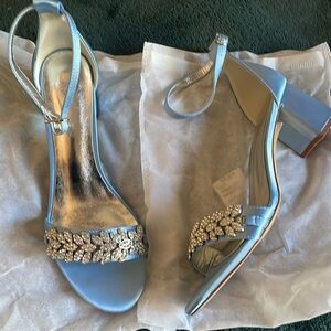 Brand new low heels. Light blue satin with rhinestone detail.